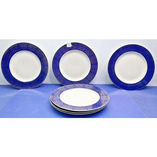 Nice set of American made vintage dinner plates in cobalt and gold decor by Homer McLaughlin. Gilt edge trim.