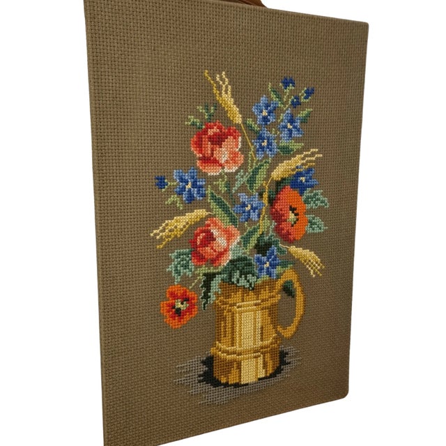 This vintage Scandinavian wall art, crafted in the 1960s-70s, features a beautifully hand-embroidered floral motif with...