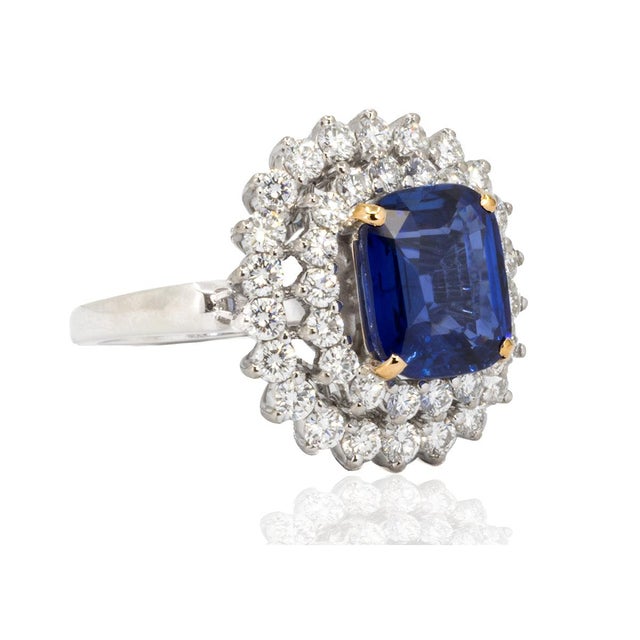 14k White gold ring with 4.03 carat royal blue sapphire and 1.56 carats of colorless round brilliant diamonds. 9.89 grams