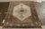 Originating from Persia circa 1950-1960, this vintage Persian rug is a distinct piece of its Qum design lineage with...