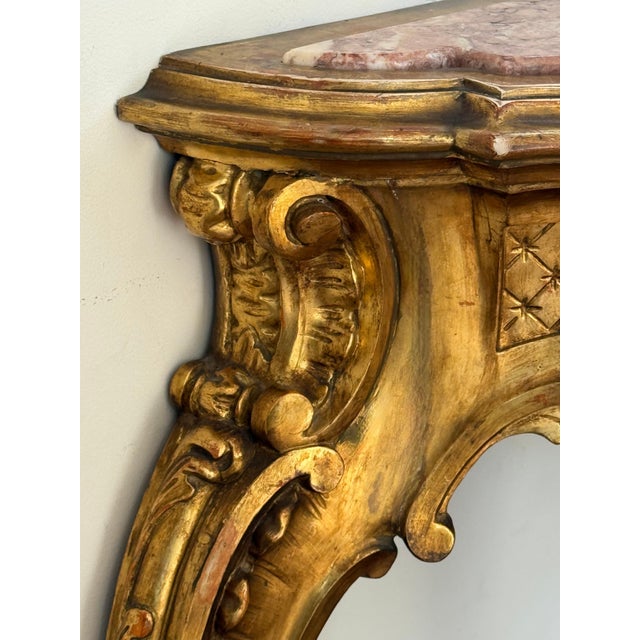 A magnificent and large scale Spanish 20th century Baroque style, ormolu and pink marble embedded console. The most...