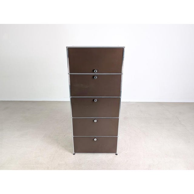 Beautiful brown USM Haller filing cabinet, size 1x5, for sale. The unit features five compartments, four of which have...