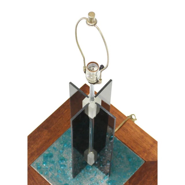 Nice design smoked lucite X-base table lamp. Made in the mid 20th century.