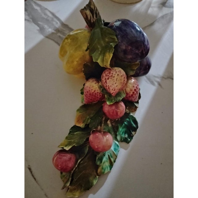 Handcrafted ceramic centerpiece with intricately painted fruits vegetables and leaves. Authentic Italian piece styled...
