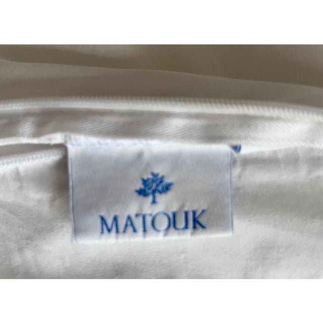 This classic 100% cotton King-sized duvet cover is made by MATOUK in the "Essex" pattern featuring Navy and Light Blue...