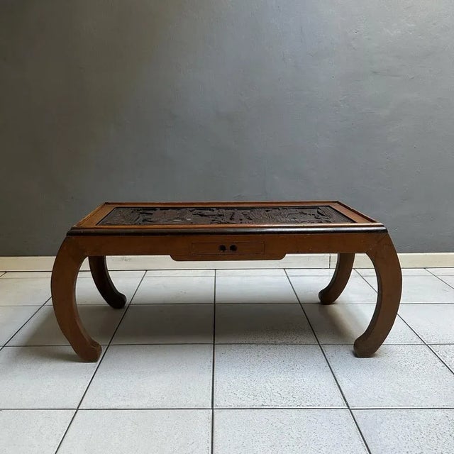 Rectangular seventies table, Chinese manufacture. The structure is in wood inlaid with typical oriental decorations,...