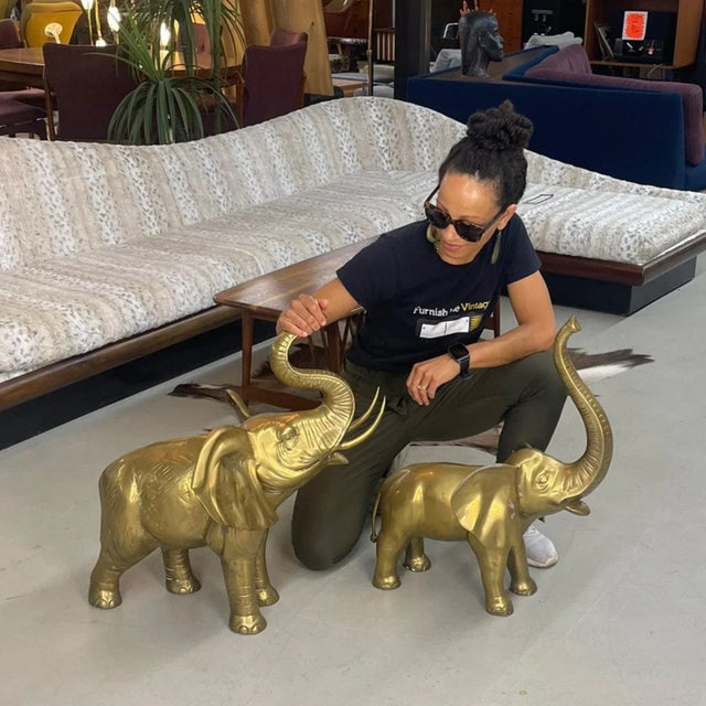 Exceptional pair of vintage large scale brass elephant sculptures. One is larger, one is slightly smaller but they both...