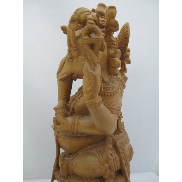 Seated Lord Ganesha Holding Fruit Carved Wood Hindu Deity God Statue on Pedestal For Sale - Image 9 of 13