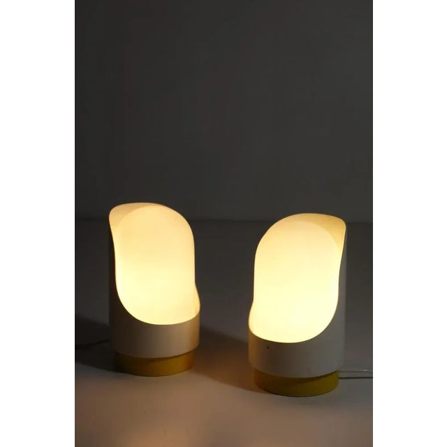 - Satin glass diffuser - Enameled metal shell - Shell is rotatable for a more or less diffused light - Made in the 1960s...