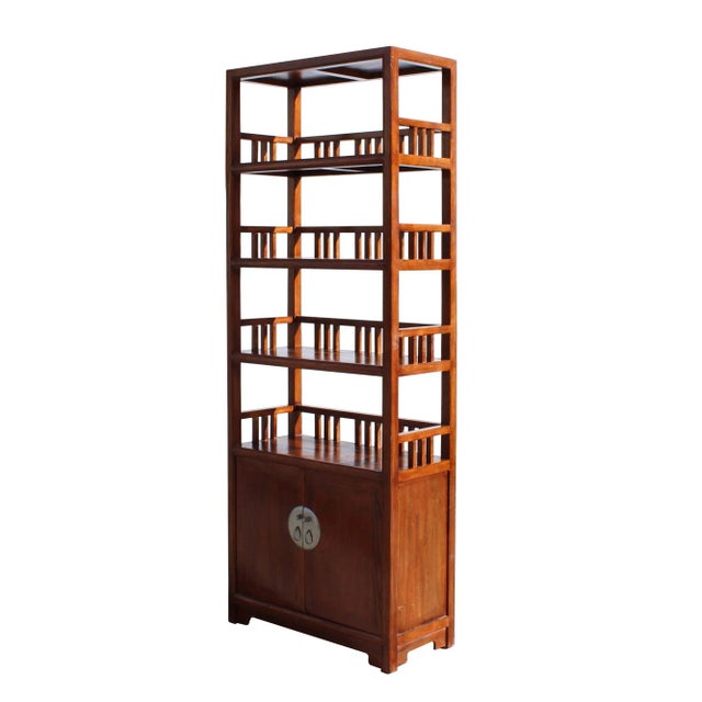 This is an oriental zen simple style bookcase display cabinet with a brown stain finish. Each shelf has bar panel around...