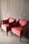 A striking pair of 20th-Century French inspired bergère chairs by Woodmark Originals upholstered in a rich pink damask....