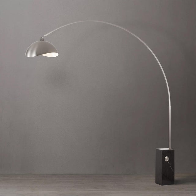 Satin Nickel paired with a Black Marble Base defines the Iconic Arc Lamp, a Mid-Century Modern arc lamp designed for...