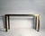 Greek Key Brass and Glass Console by Mastercraft. Made in Italy. This console is period 1970s and is designed to be...