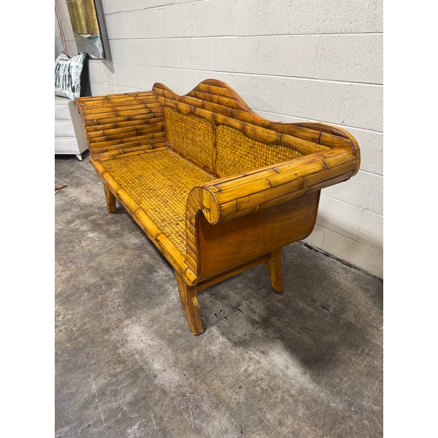 Splendid and pencil reed woven bamboo sofa with three cushions. Excellent condition. Three cushions are okay. This would...