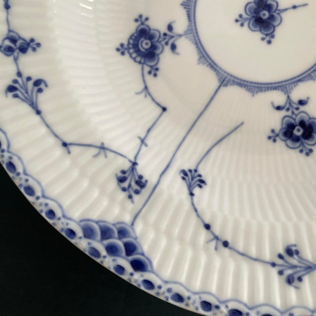 A antique soup bowl by Royal Copenhagen. The bowl was made between 1889 and 1922. The bowl measures 9.5 inches in diameter...