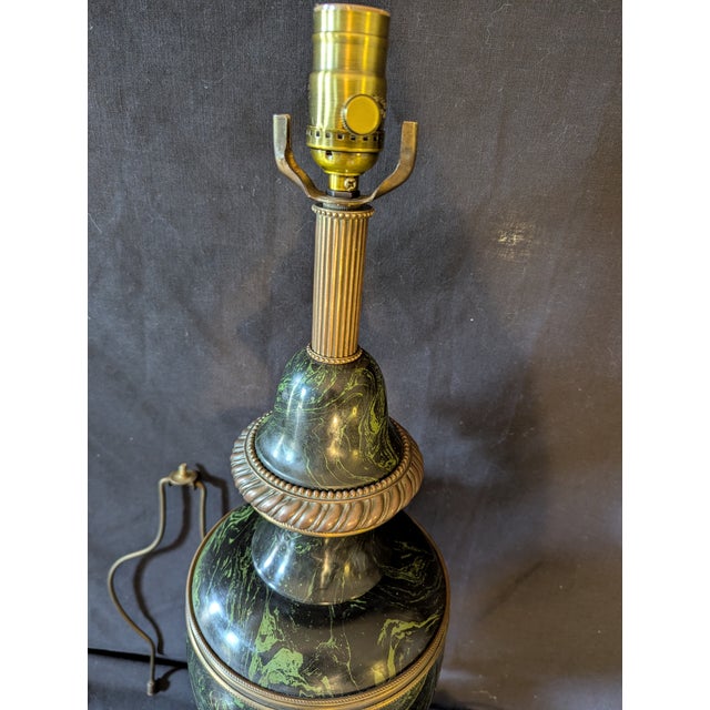 A monumental faux malachite lamp, painted wood with very fine bronze castings, rewired with dimmer switch socket. Height...