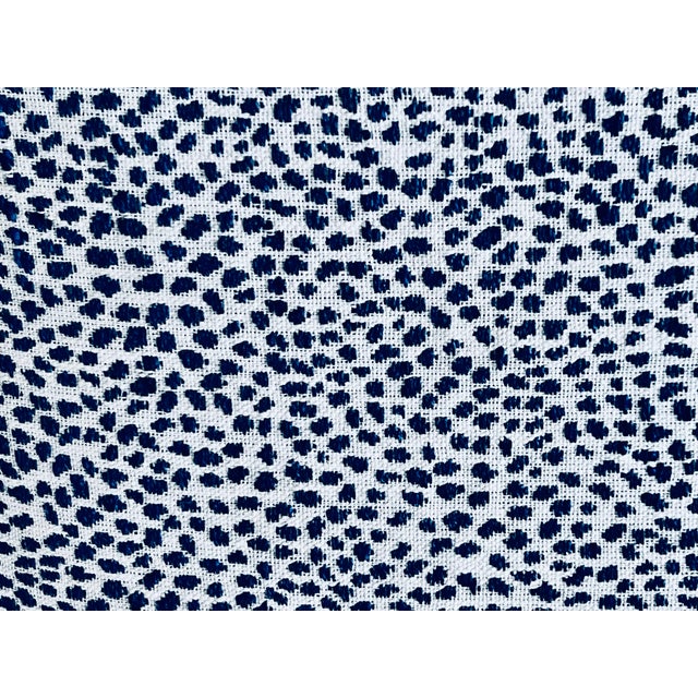 Pair of pillows/cushions in a mini blue animal print on a light ground. The edges are boxed out with a blind zipper at the...
