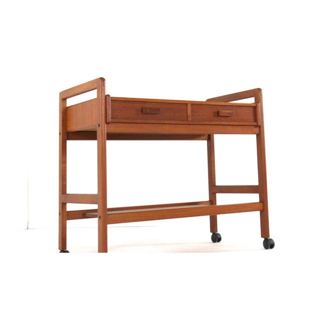 Sleek teak trolley. Its beautiful, timeless appearance is thanks to the straight lines in the design, both horizontally...