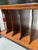 A wonderful Art Deco-style side table on casters designed for vinyl LP record album storage (or for large coffee table...