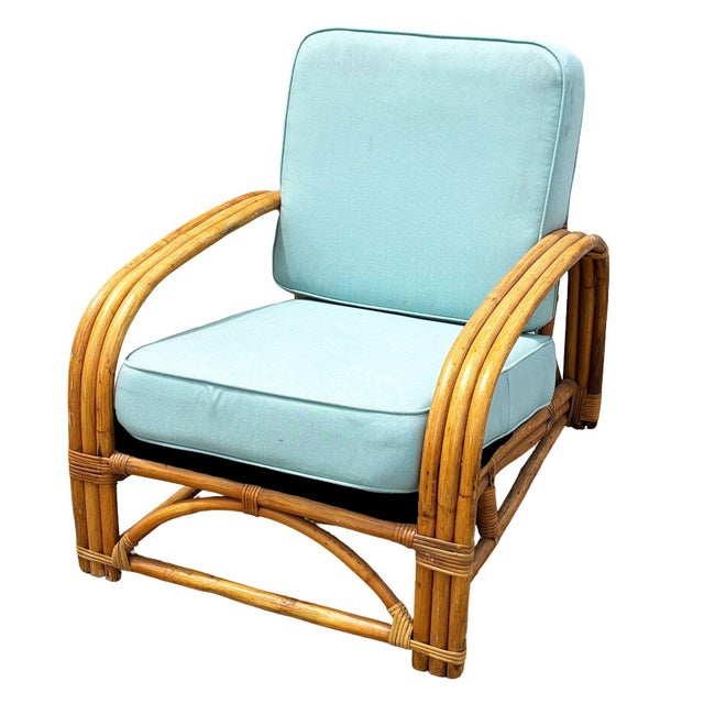 This beautifully restored Paul Frankl inspired rattan lounge chair features a triple-strand half Square moon arm design...