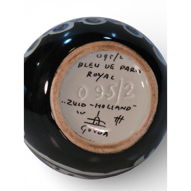 This is a gorgeous pair of vases and beautifully graphic! they feature a swirled outsized pattern of traditional faience...