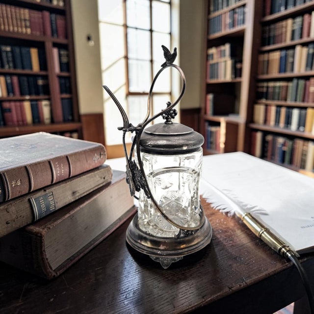 A late 19th-century Rockford Silver Plate Company pickle castor, model no. 694, distinguished by its figural bird finial...