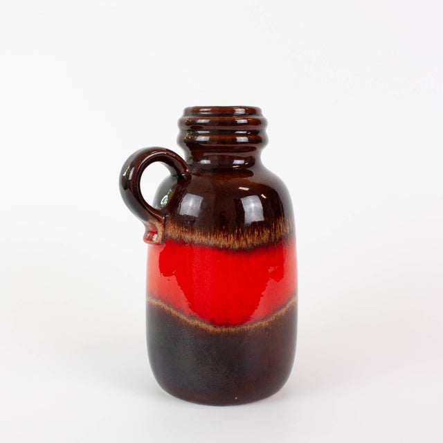 Bring timeless Mid-Century style into your home with this authentic Scheurich West German ceramic vase, produced in the...