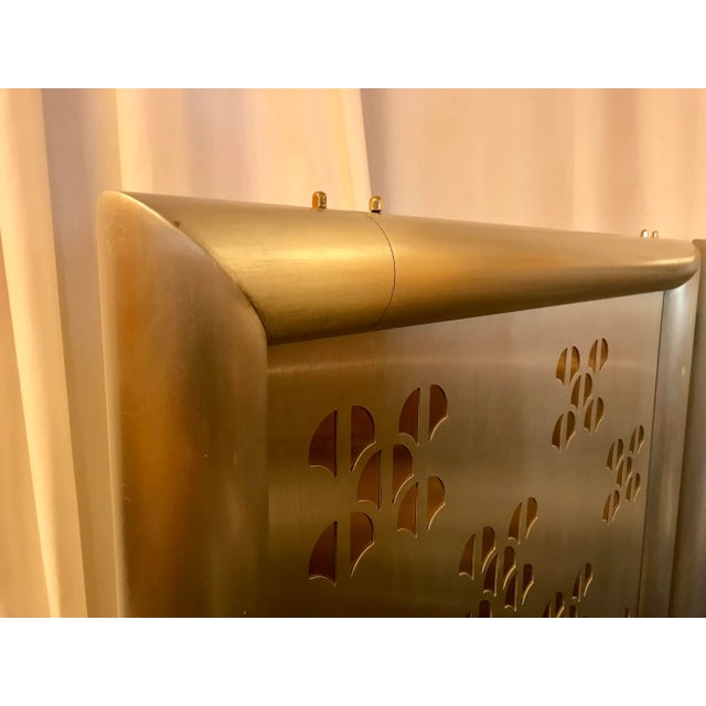 Heavy aluminum screen or room divider. It is pierce cut with mid century into post modern designs. The double panels are...