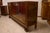 Art deco buffet sideboard in walnut burl with two sliding glass doors, curly carved feet, a closed door and two drawers,...