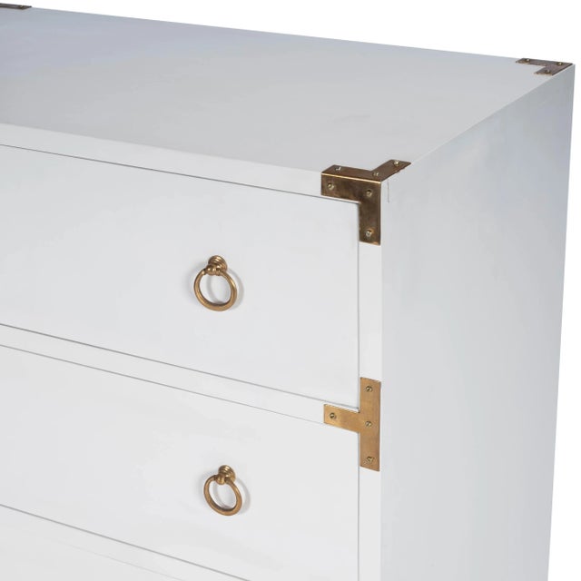 This three-drawer campaign dresser is a stylish addition to virtually any contemporary space. Features a glossy white...