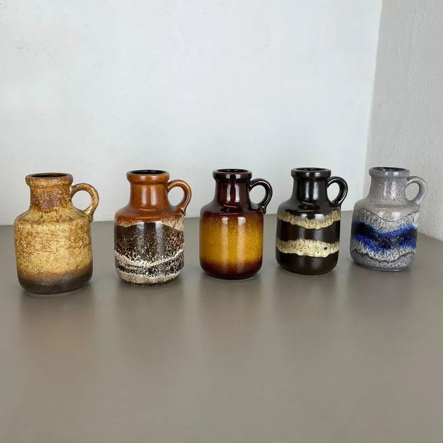 Set of five fat lava art vases Model: 414-16 Producer: Scheurich, Germany Decade: 1970s These original vintage vases was...
