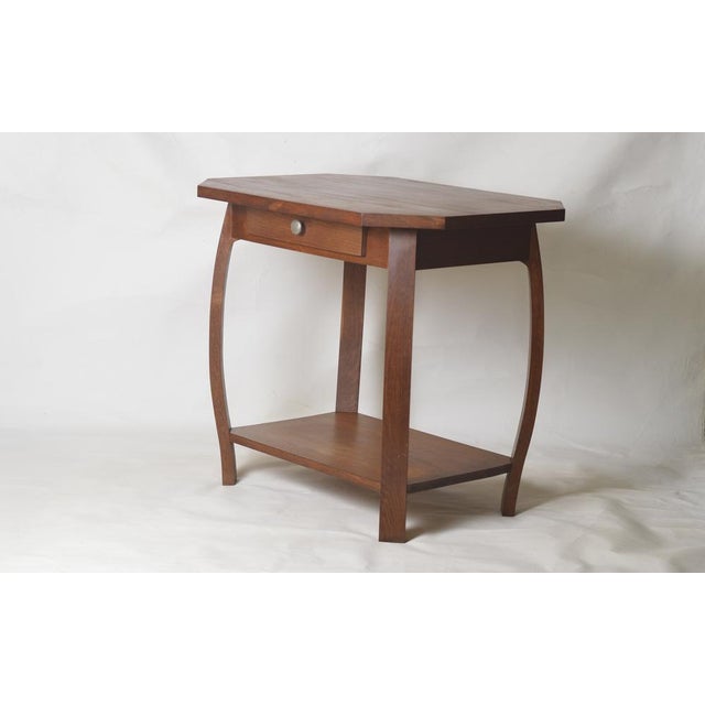 This Art Deco side table is distinguished by its timeless elegance and solid oak construction. Its geometric lines,...