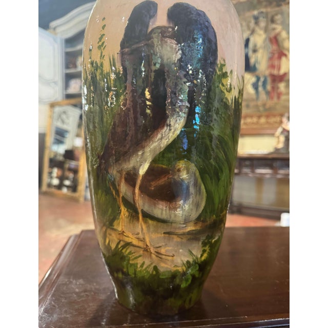 This colorful antique majolica urn was sculpted in Montigny sur Loing, France, circa 1880. Tall and round in shape, the...