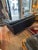 Super luxurious Danish midcentury modern black leather down filled sofa by Stouby having cylindrical beech legs. Back side...