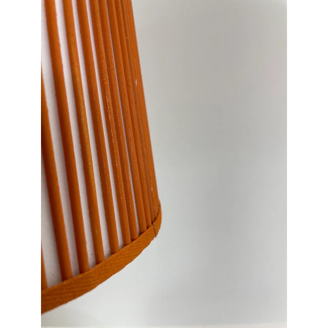 Solid orange sticks are added by hand, one at a time, over artisanal, vellum paper. This Stick Shade will add charm to any...