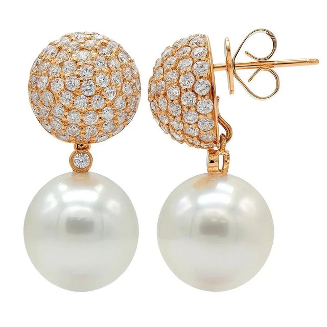 18k Rose gold earrinds with two 12.5mm South Sea Pearls and 2.11 carats of pave set round brilliant diamonds.