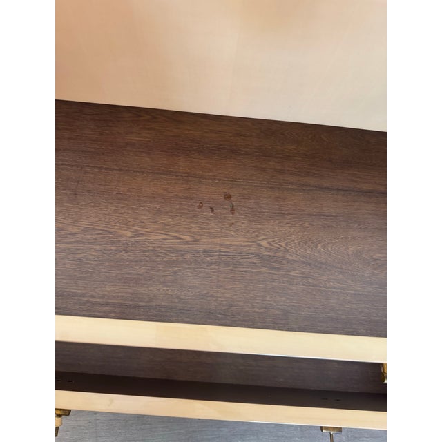 Bring a touch of timeless elegance to your home with this pair of vintage Art Deco nightstands, featuring a warm tan...