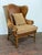 Embossed crocodile cognac leather wingback chair by Davis & Shaw. The chair features a large brass tack edging, multi-...