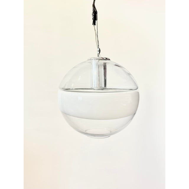 Italian Space Age lamp in opal white and transparent Murano glass. This piece is attributed to the mentioned...