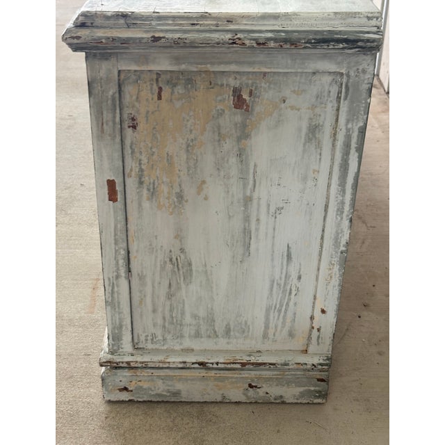 A wonderfully characterful French painted enfilade, sourced in France, with a beautifully timeworn pale blue-gray and...