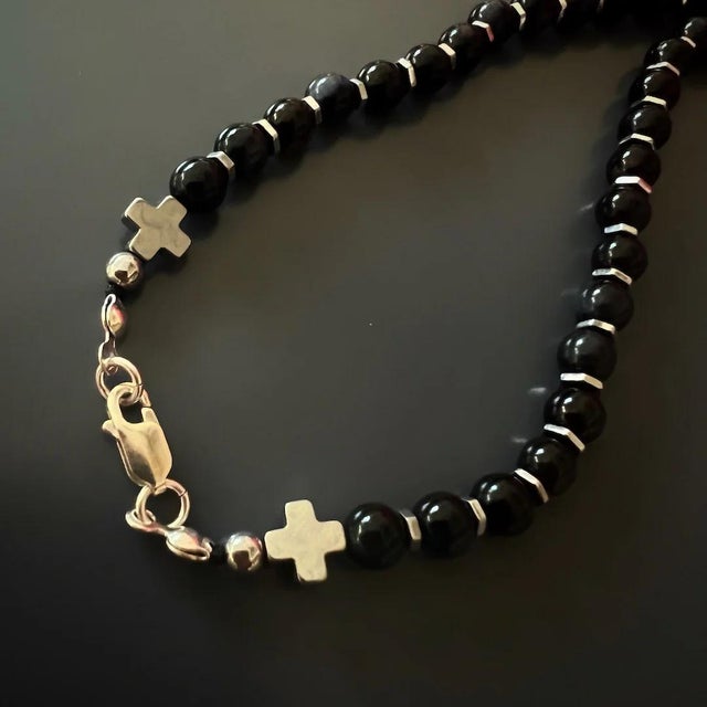 Guardian Angel Faravahar Pendant Black Tourmaline Beaded Necklace features a strand of meticulously chosen black...