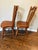 A beautifully preserved pair of authentic Cushman Colonial Creations side chairs crafted from solid maple in Bennington,...