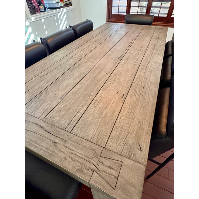 Classic Home reclaimed oak dining table + 8 Four Hands black leather chairs. Beautiful modern farmhouse set with a wide-...