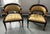 Beautiful pair of art nouveau, Egyptian revival style comfortable statement chairs. Features carved mahogany with an...