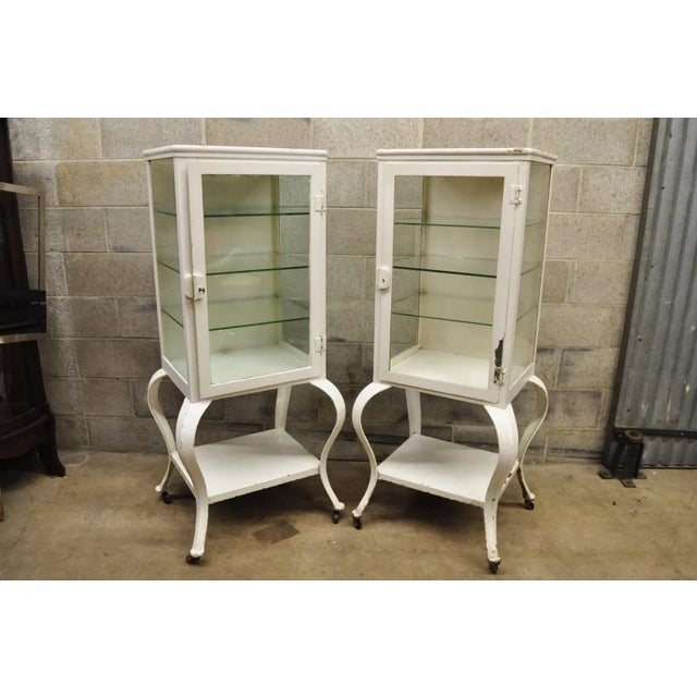 Rare Pair of Antique Art Deco Cabriole Leg Steel Metal Medical Dental Pharmacy Cabinets. Cabinets feature, lower shelf, 1...