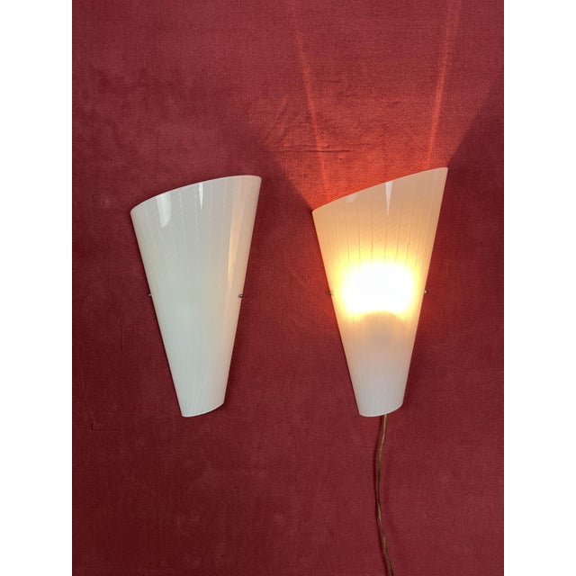 Set of 2 large Murano glass wall lamps, 1980s Metal structure, E27 lamp Intact and in good condition. Height 44 cm....