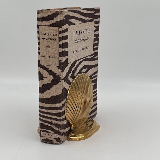 This is a pair of vintage Venetian Grotto seashell brass bookends or doorstops. Each piece weighs 1 pound, making them...