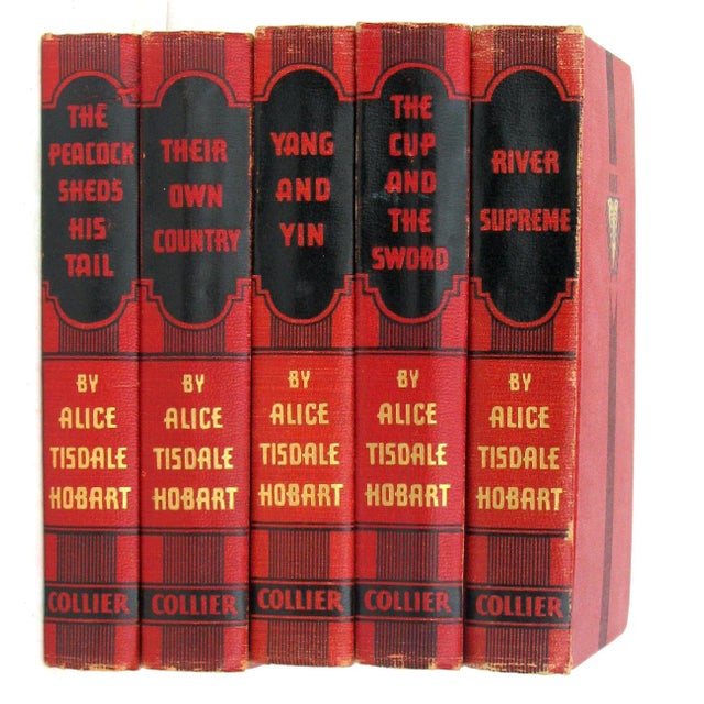 Handsome collection of five red bindings with black & gold accents containing novels by Alice Tisdale Hobart. Includes...