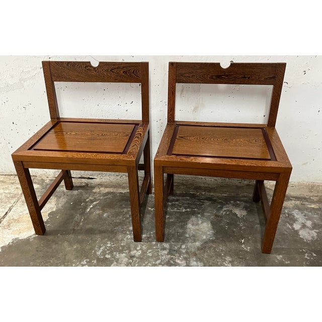 This rectilinear modernist accent or dining chair is constructed of solid woods by Studio Upstairs. A Chinese influenced...