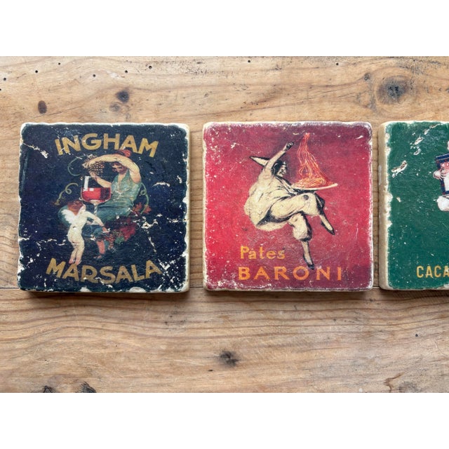 A charming set of four vintage Italian advertising ceramic coasters featuring colorful early 20th-century promotional...